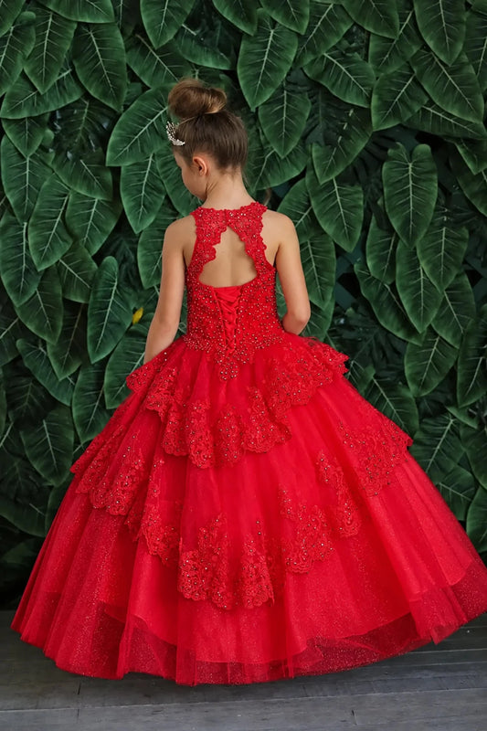 Behind the full skirt, the Red mini quince dress displays its lace-up finish and full layered tulle skirt with ruffle tiers.