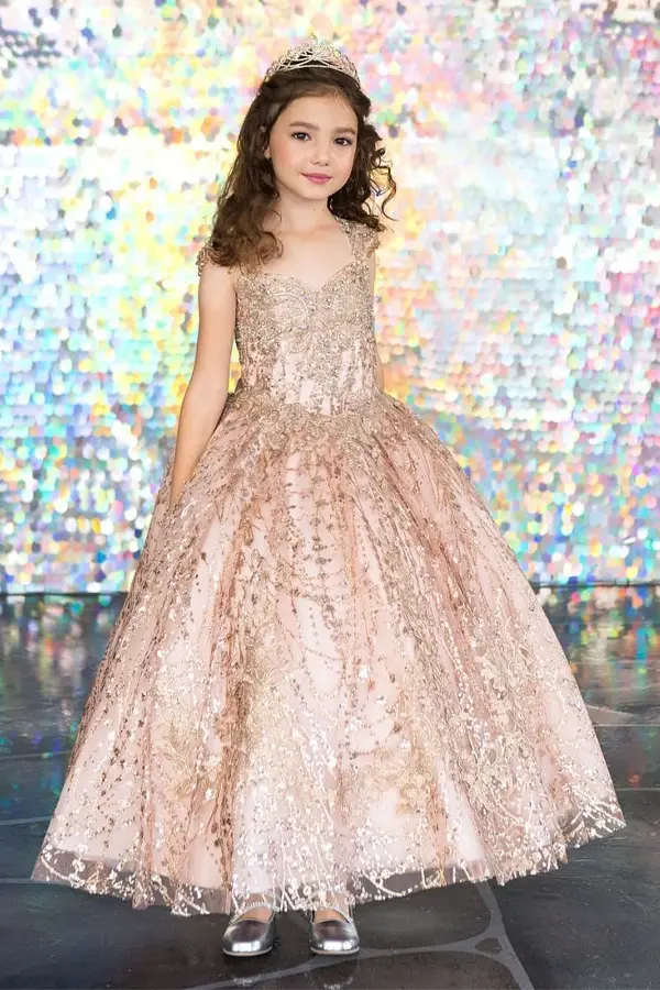 Front view of glamorous rose gold mini quince dress with glitter embroidery bodice, beaded sleeves, and voluminous layered skirt.