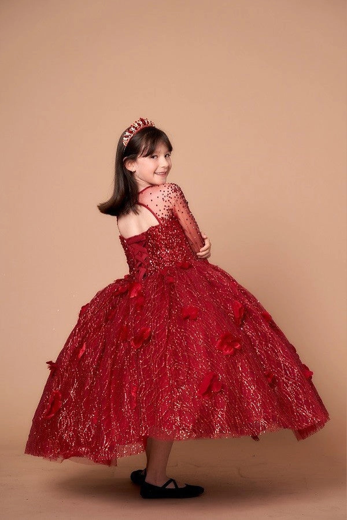 The additional image shows full textured formal ball gown skirt on the Burgundy mini quince dress.