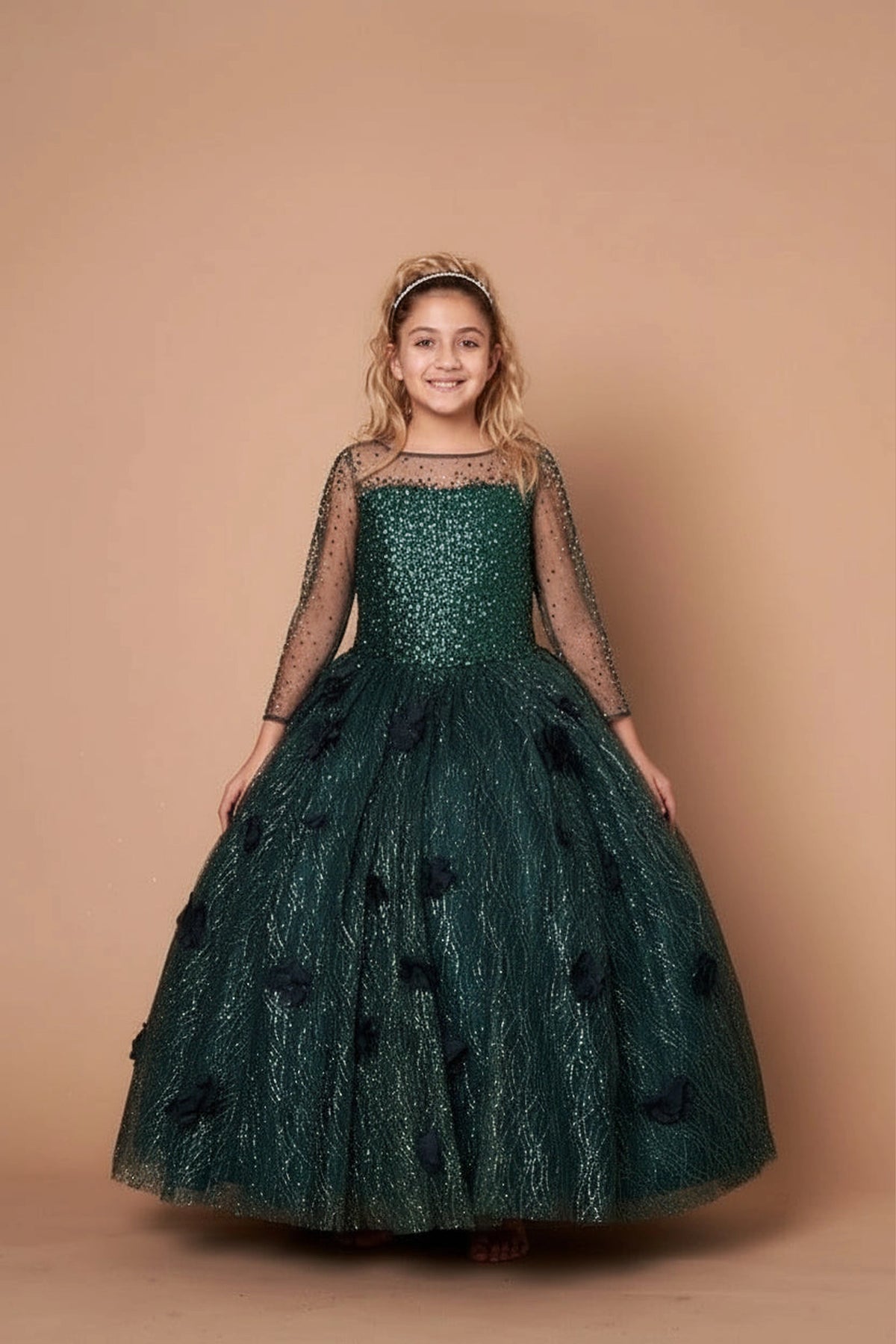 At the bodice and skirt, the Emerald Green mini quince dress showcases sheer long sleeves with glitter lace embroidery and full textured formal ball gown skirt.