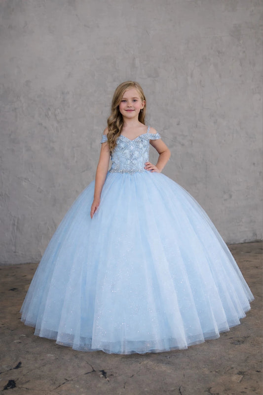 Rich texture defines, the Bahama Blue/Silver mini quince dress showcases metallic embroidered off-the-shoulder bodice and full tulle skirt with coordinating two-tone detail.