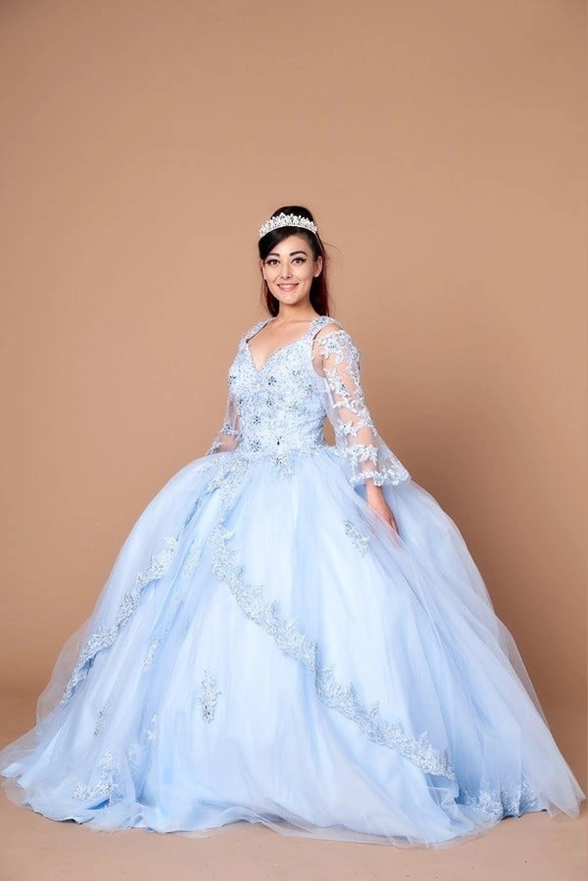 Bahama Blue quinceañera ball gown with long sheer sleeves, floral embroidery and a full skirt.