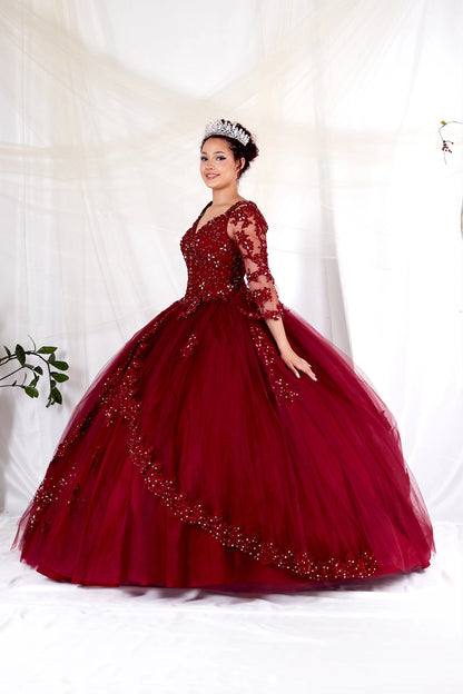 Burgundy quinceañera ball gown featuring long embroidered sleeves and a richly decorated skirt.
