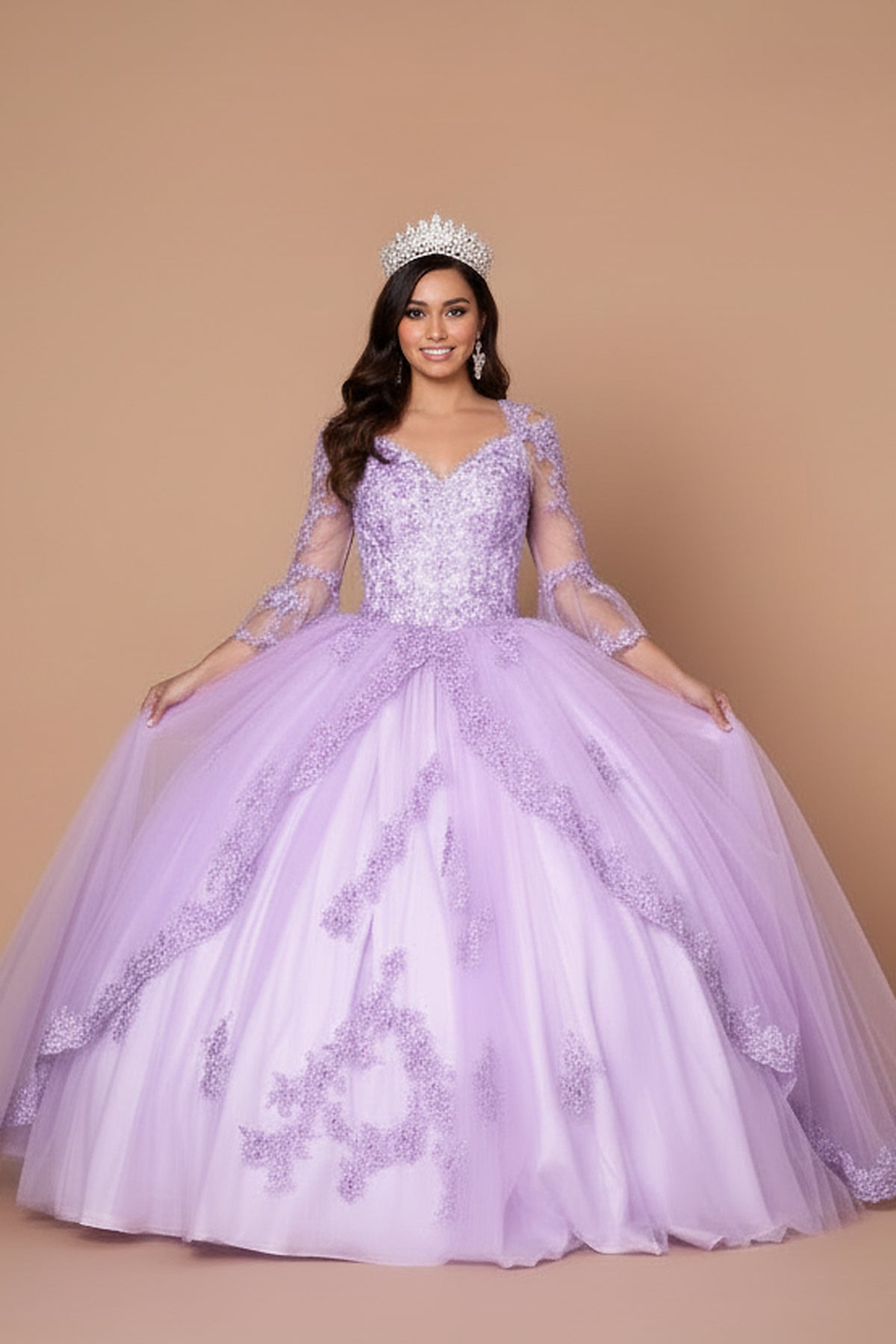 Floral embroidery creates layered curves over the full skirt of the Lilac quinceañera ball gown.
