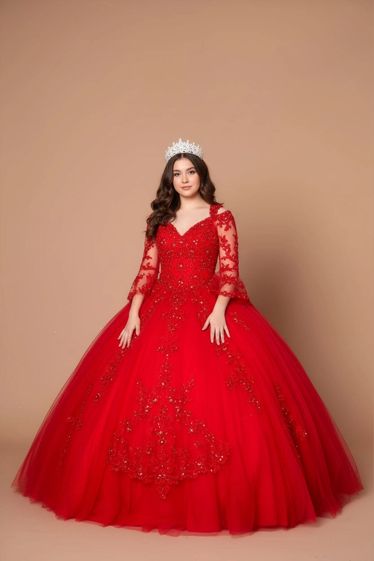 Red quinceañera ball gown with long embroidered sleeves and layered floral detailing on the skirt.