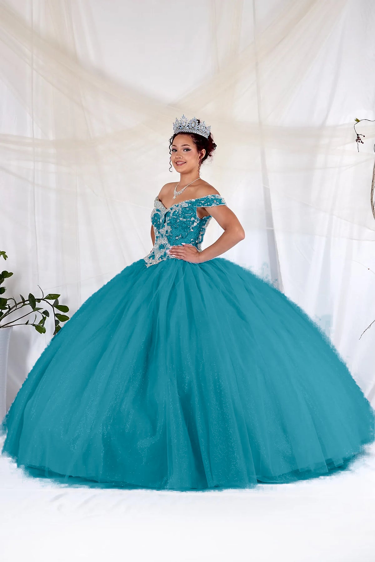 Jade/Gold quinceañera ball gown with an embellished off-shoulder bodice and a full tulle skirt.