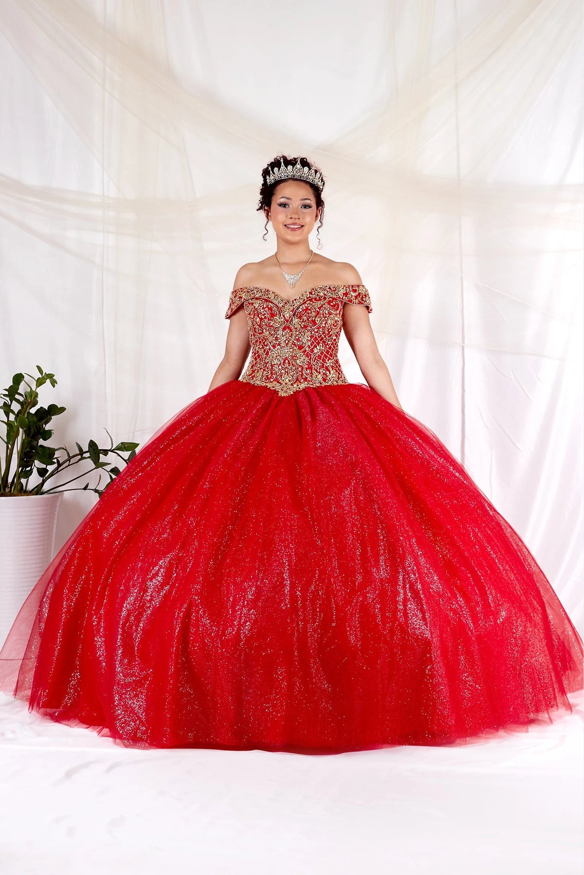 Red/Gold quinceañera ball gown with an off-shoulder embroidered bodice and glitter tulle skirt.