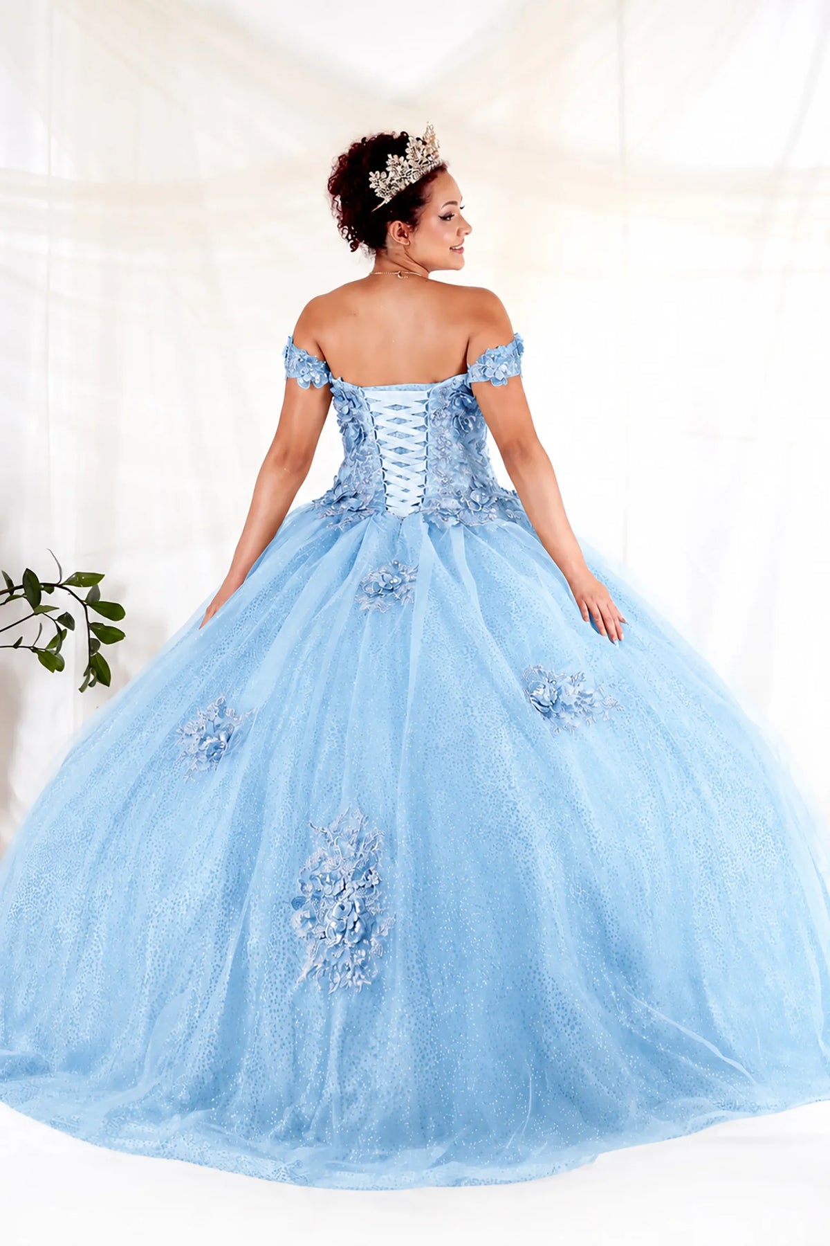 From behind, the Bahama Blue quinceañera ball gown reveals a shaped lace-up back and the sweep of the full skirt.