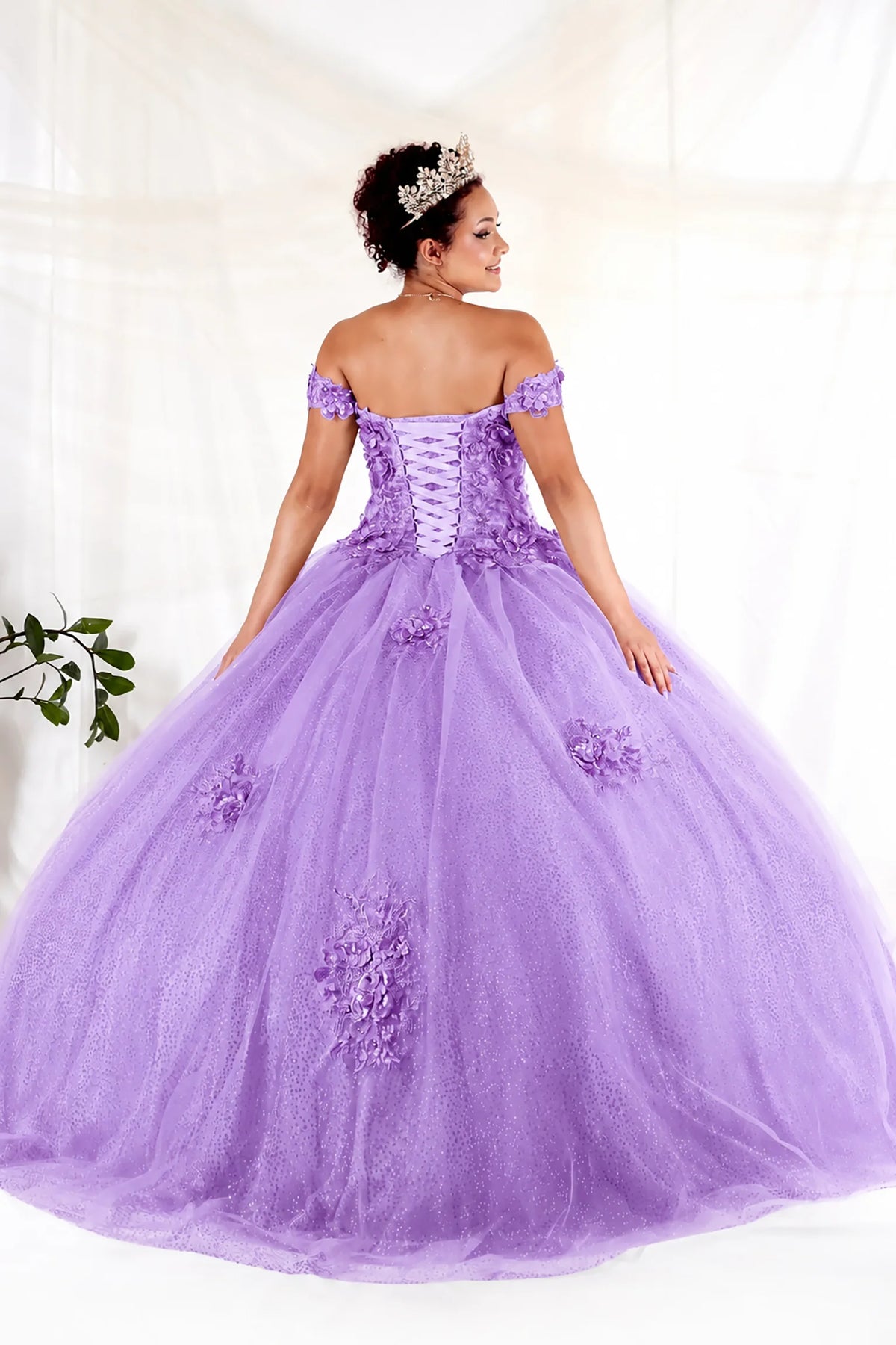 From behind, the Lilac quinceañera ball gown reveals a shaped lace-up back and the sweep of the full skirt.