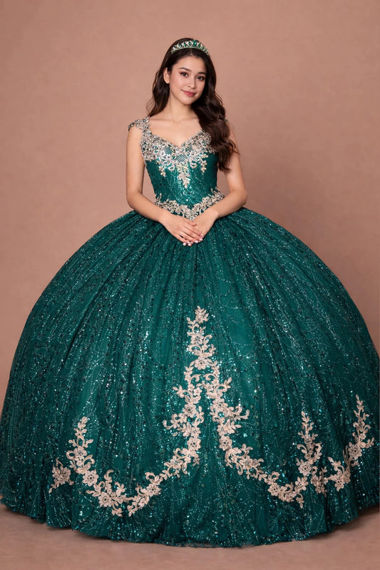 Emerald Green quinceañera dress showcases metallic embroidered scrollwork above sparkling full ball gown silhouette.