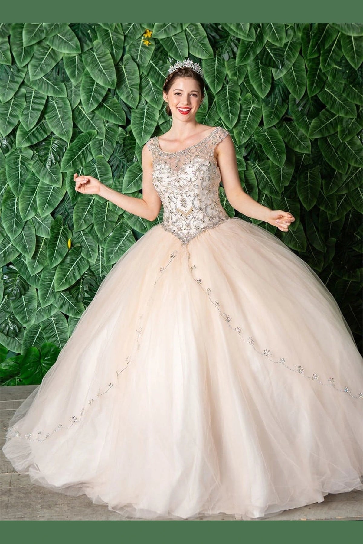 Champagne quinceañera dress showcases jeweled sleeveless bodice above softly layered full skirt.