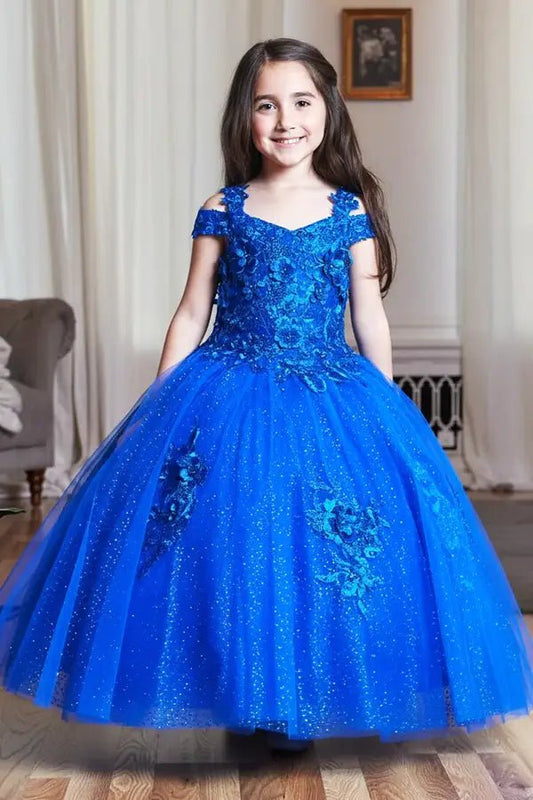 Kid standing front-facing in elegant royal blue mini quince dress with shiny tulle bodice and voluminous short skirt