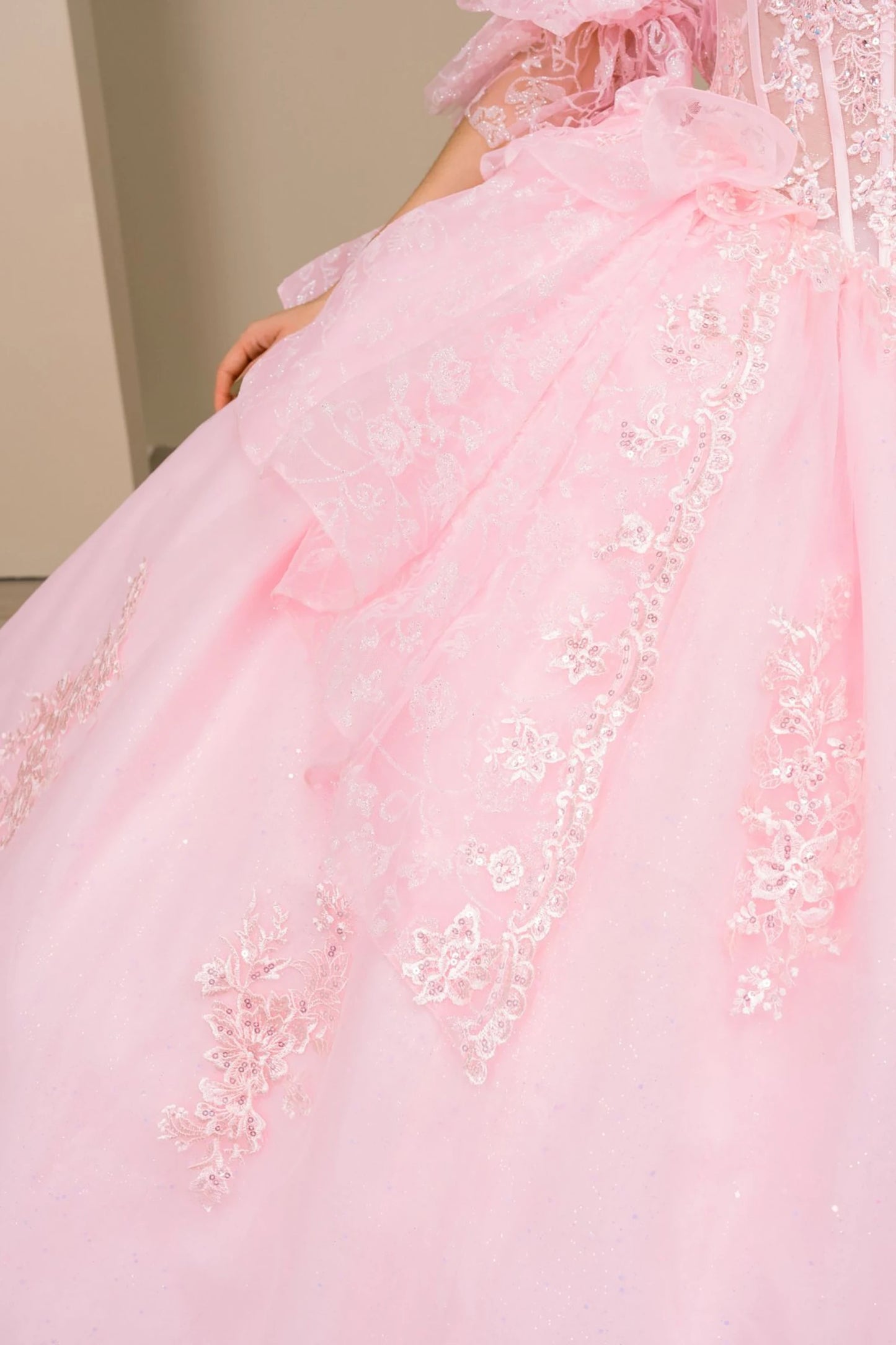 Close-up of lower details in  pink off-shoulder sweetheart quinceañera dress with beaded embroidered corset bodice and sweetheart neckline