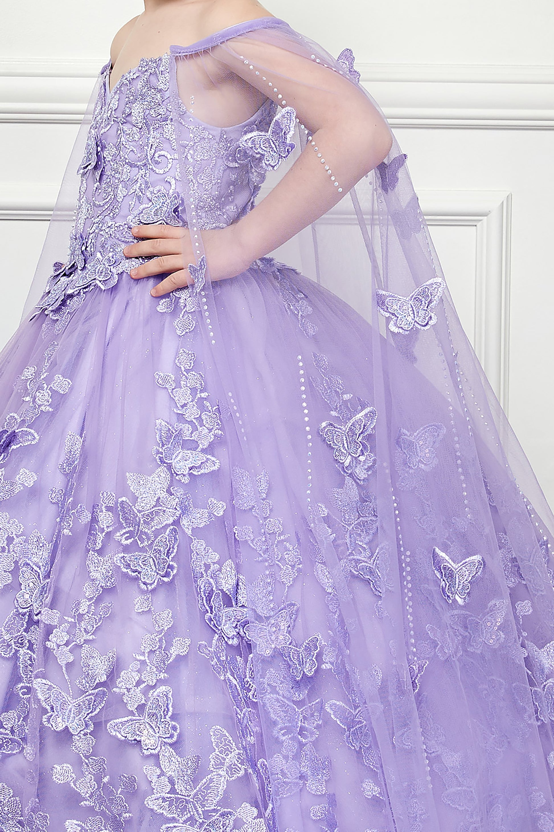 Lilac Mini Quince | 3D Butterfly Floral Off-Shoulder Mini Quinceanera Dress with Cape | 3 Anos dres - zoomed in side view of girl wearing dress with her hand on her hip