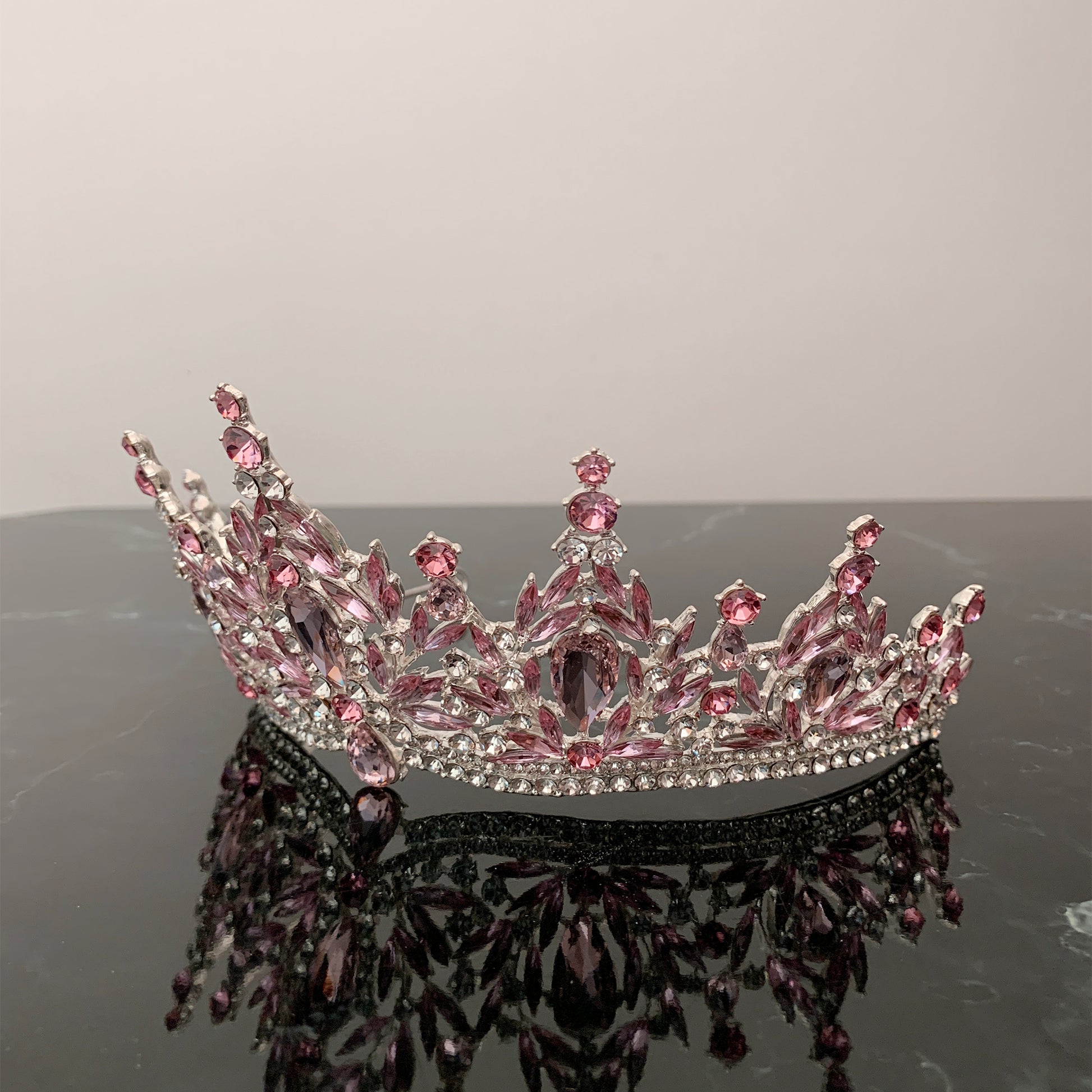 Pink silver rhinestone quinceañera tiara, side view.