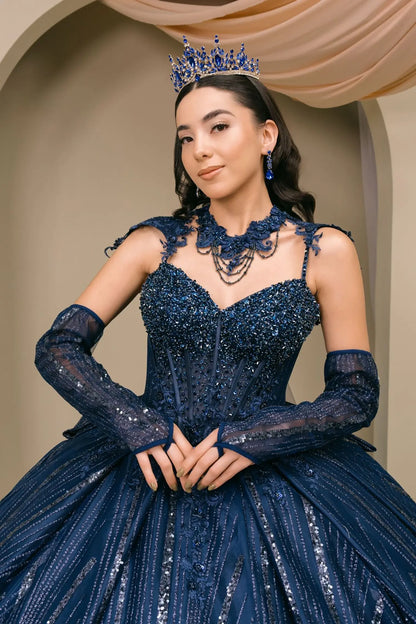 Front Close-up of woman wearing navy quinceañera royal dress with beaded corset bodice, sweetheart neckline, choker detail, and shimmering textured skirt