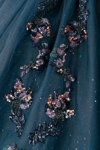 Close-up of navy quinceañera royal dress lower skirt with shimmering textured tulle layers, cathedral train, and glitter accents
