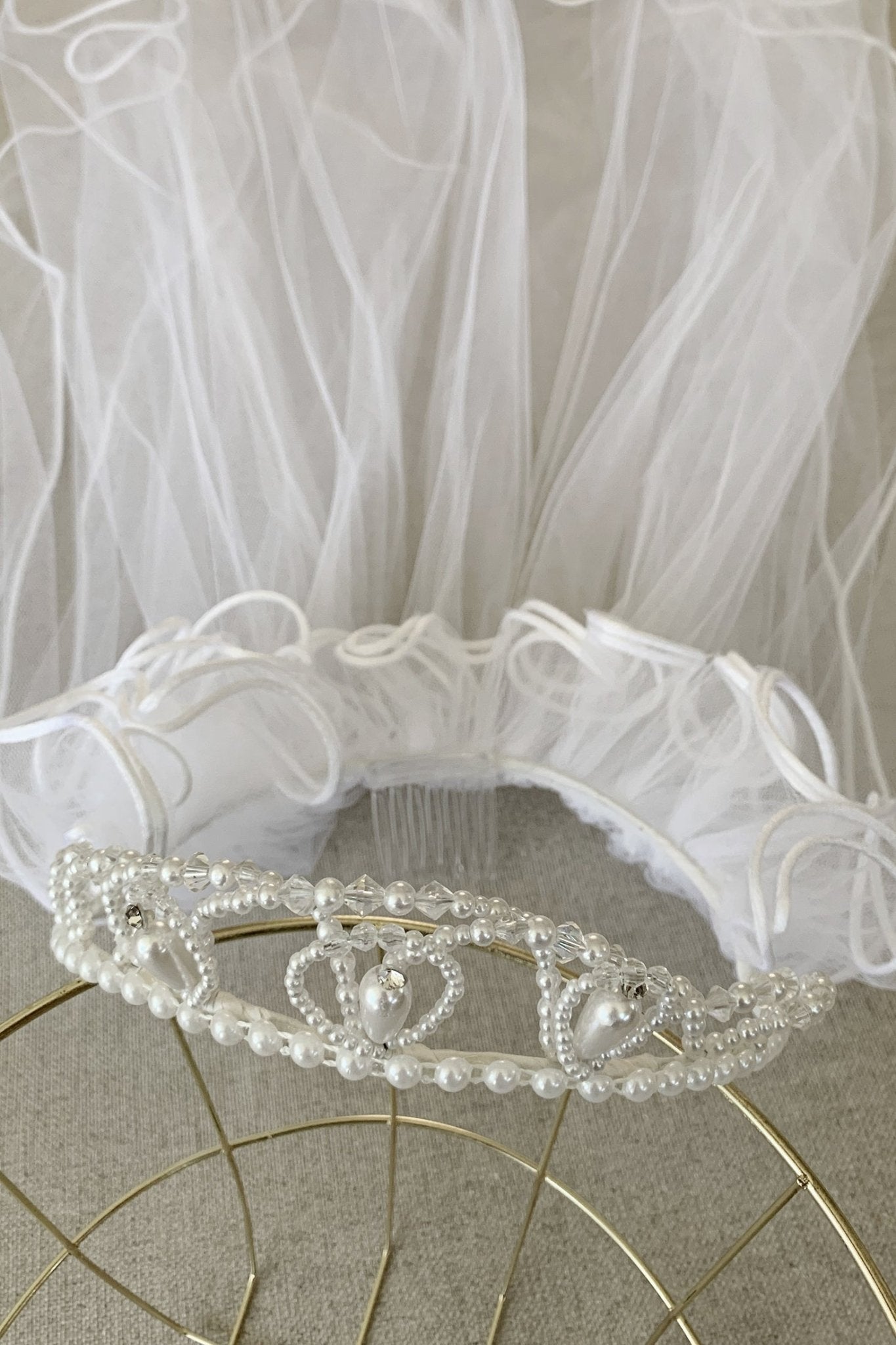 White pearl rhinestone flower girl and first communion tiara and two-tier veil.