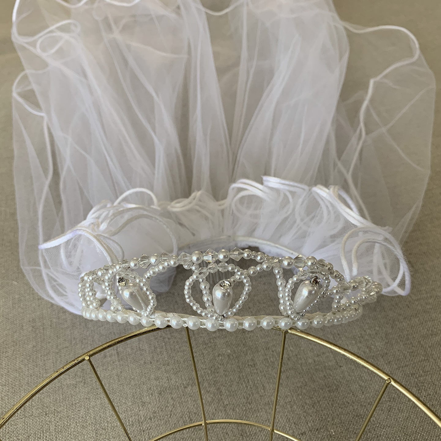 White pearl rhinestone flower girl and first communion tiara and two-tier veil.