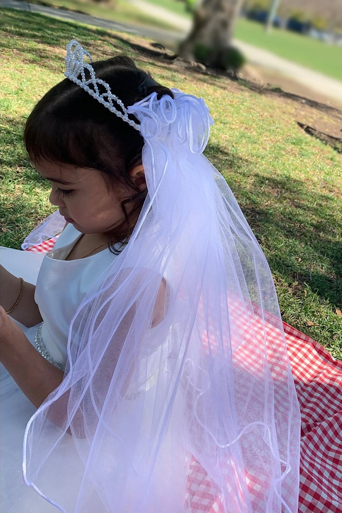 White pearl rhinestone flower girl and first communion tiara and two-tier veil.