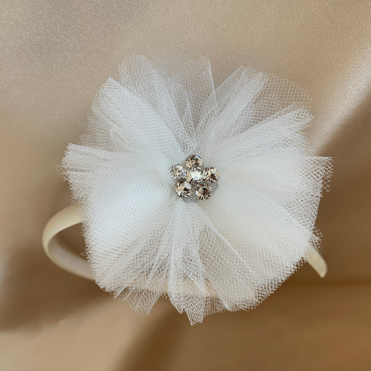 Ivory and white rhinestone chiffon flower girl headband, close-up, embellishment detail.