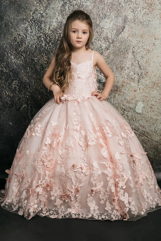 Front view of a blush kids mini quinceanera mini quince dress with 3D butterfly floral appliques, off-shoulder neckline, and flowing cape.