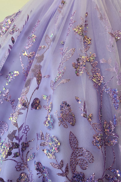 Skirt detail of a lilac kids mini quinceanera dress with layered glitter tulle fabric and detachable long train