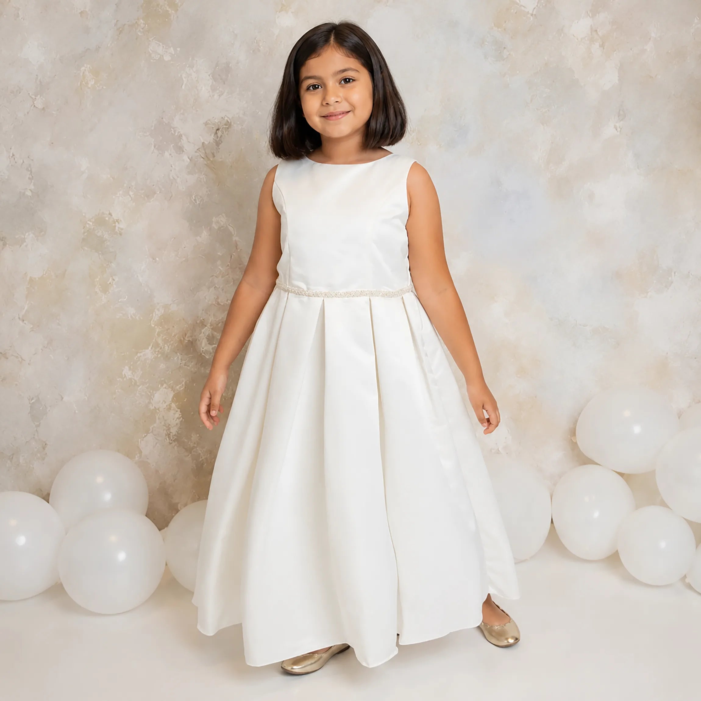 Young girl in a white plus size dress standing 