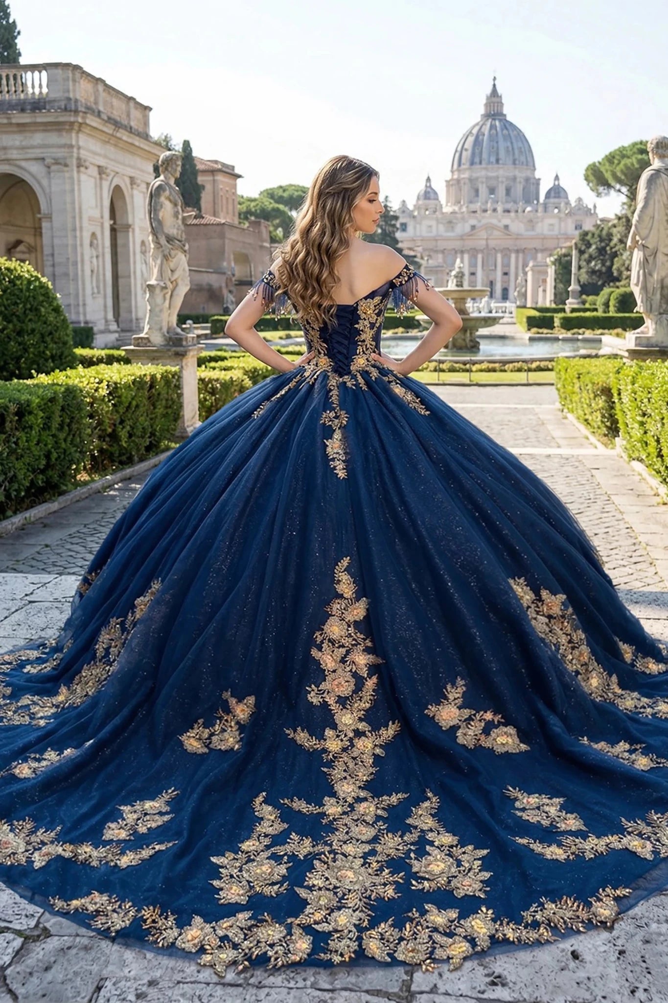 Woman in a navy quinceanera ball gown with gold embroidery and long train