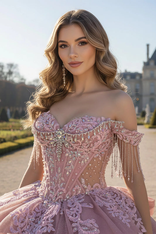 Woman in a pink, Woman wearing a rose, off-shoulder gown adorned with Sparkling accent 