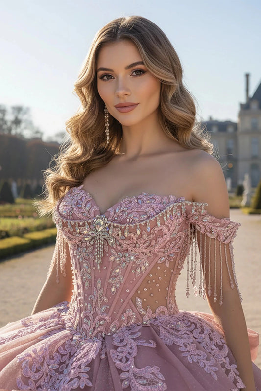 Woman in a pink, Woman wearing a rose, off-shoulder gown adorned with Sparkling accent 