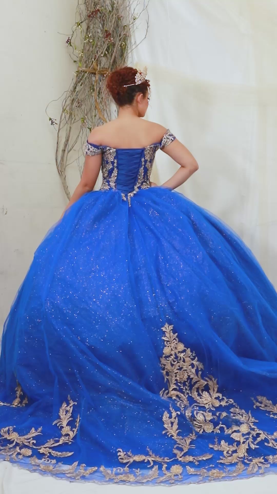 Video of Royal Blue Quinceañera Dress with Gold Embroidered and Glitter Tulle Overlay Skirt