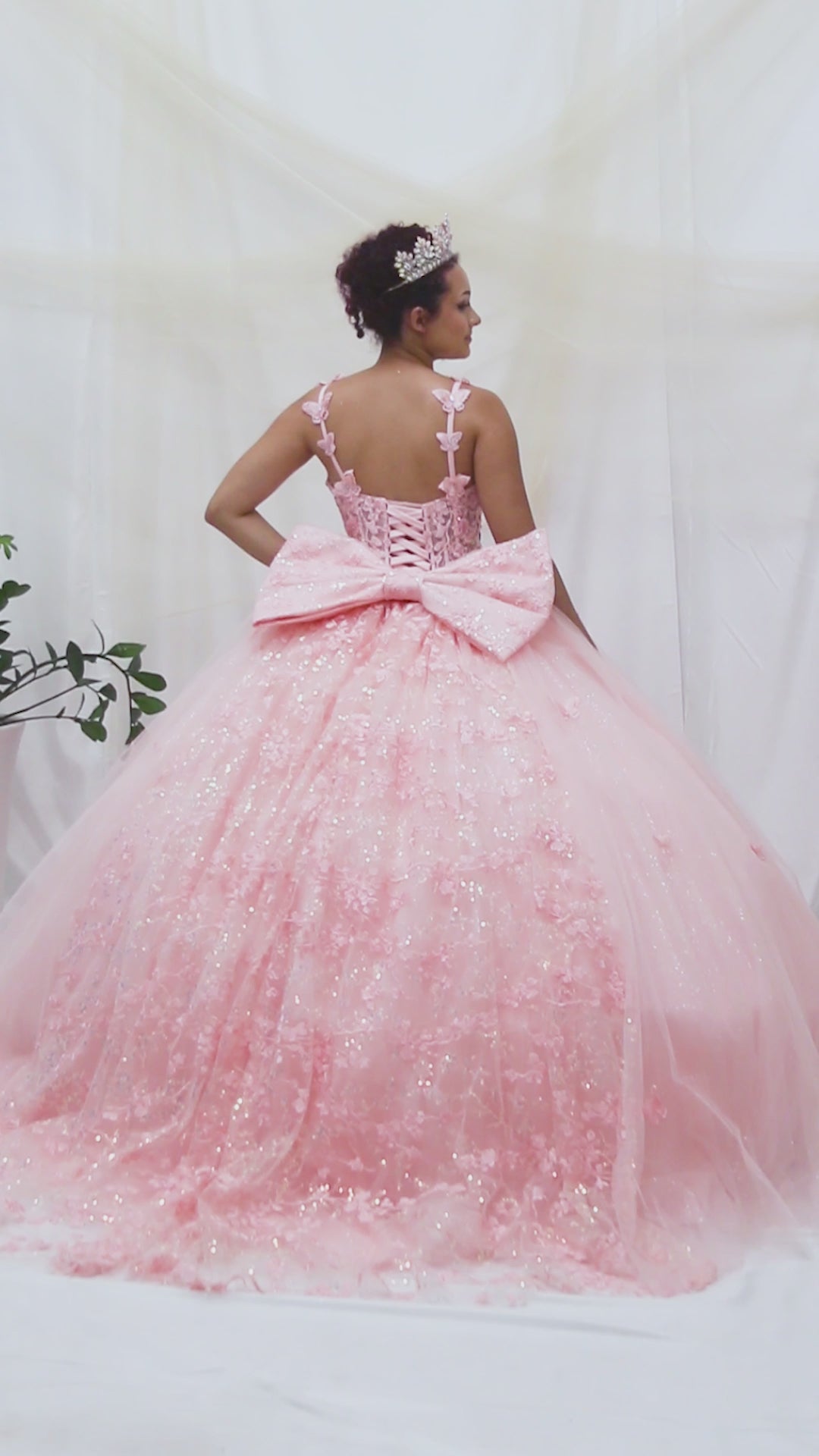 video of blush butterfly quince ball gown with extra big bow