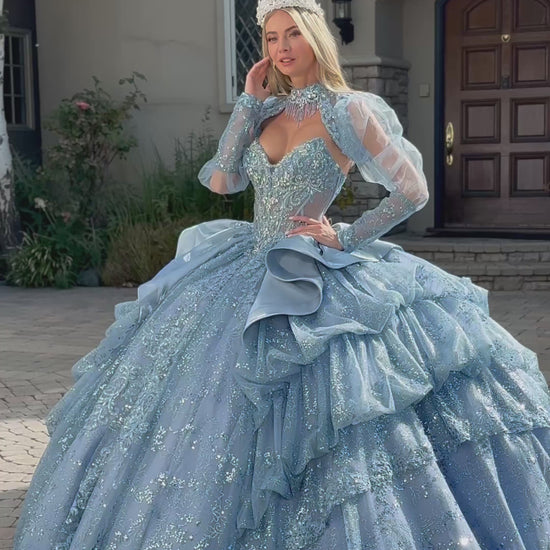 video of a girl wearing long sleeves blue quinceanera dress in front of a house