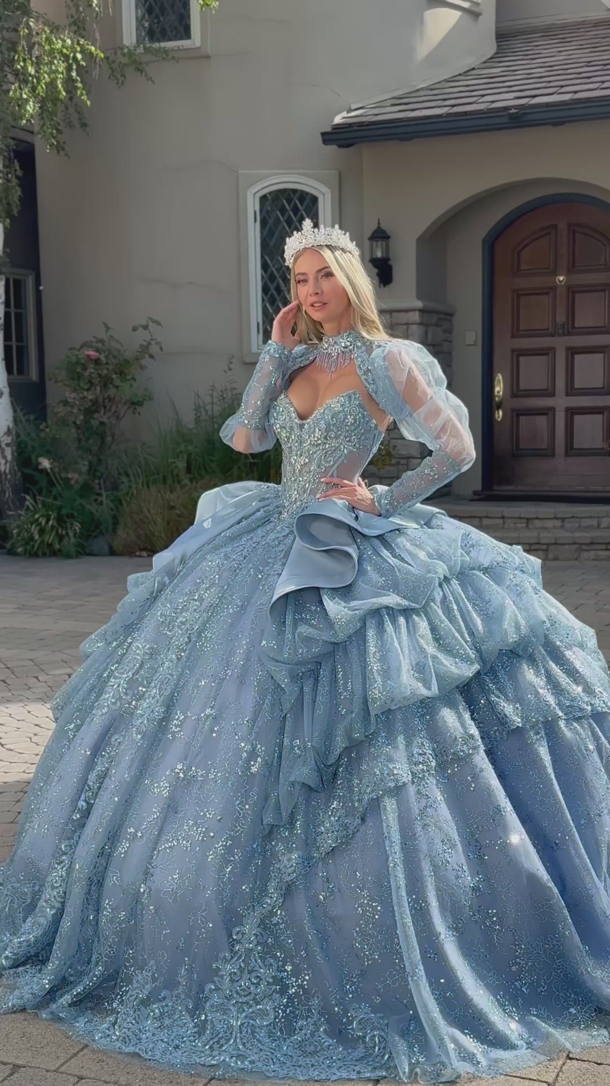 video of a girl wearing long sleeves blue quinceanera dress in front of a house
