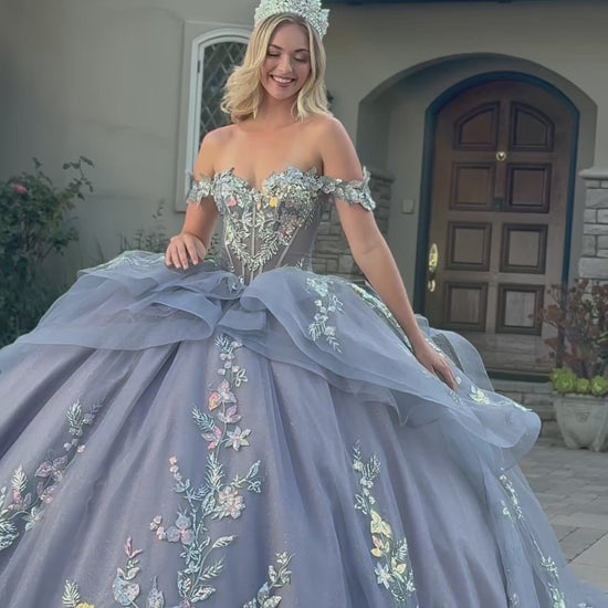 video of a girl wearing a dusty blue quince dress in front of a house