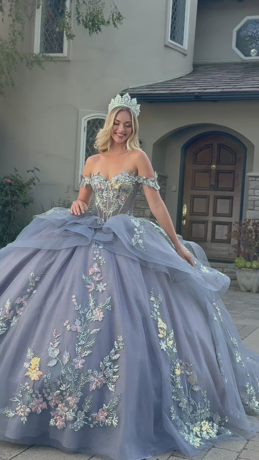 video of a girl wearing a dusty blue quince dress in front of a house