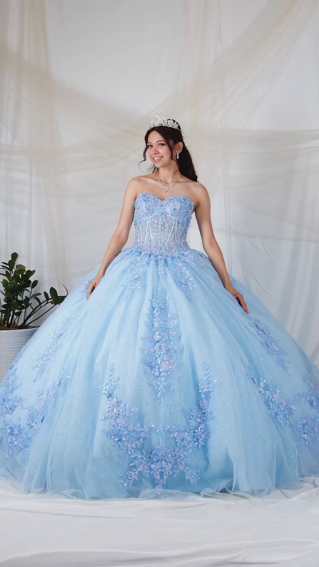 Video of Light Blue Quinceañera Dress with Beaded Bodice, Floral Appliques and Glitter Tulle Skirt