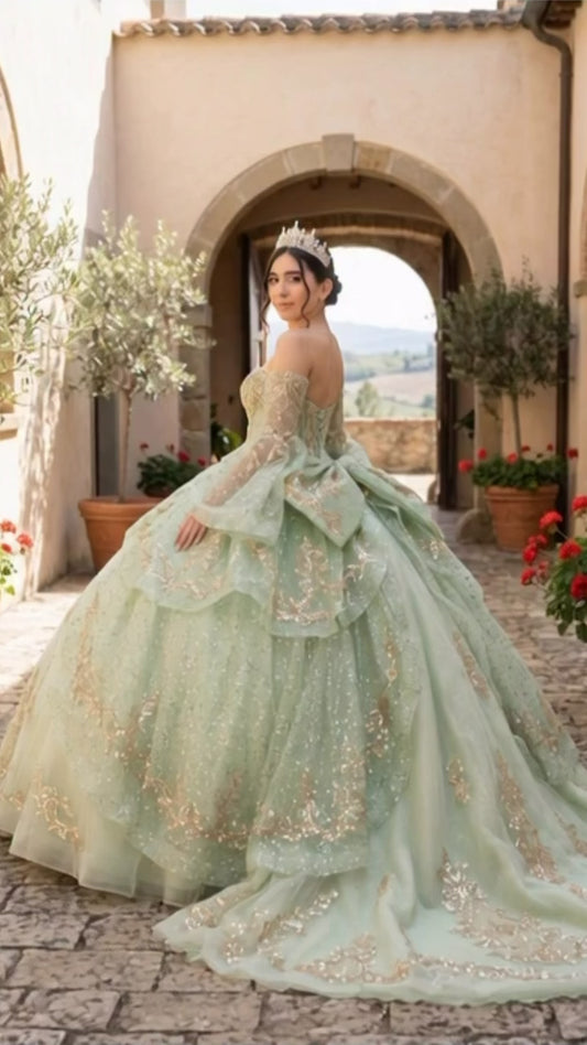 video of a girl wearing a sage quinceanera dress
