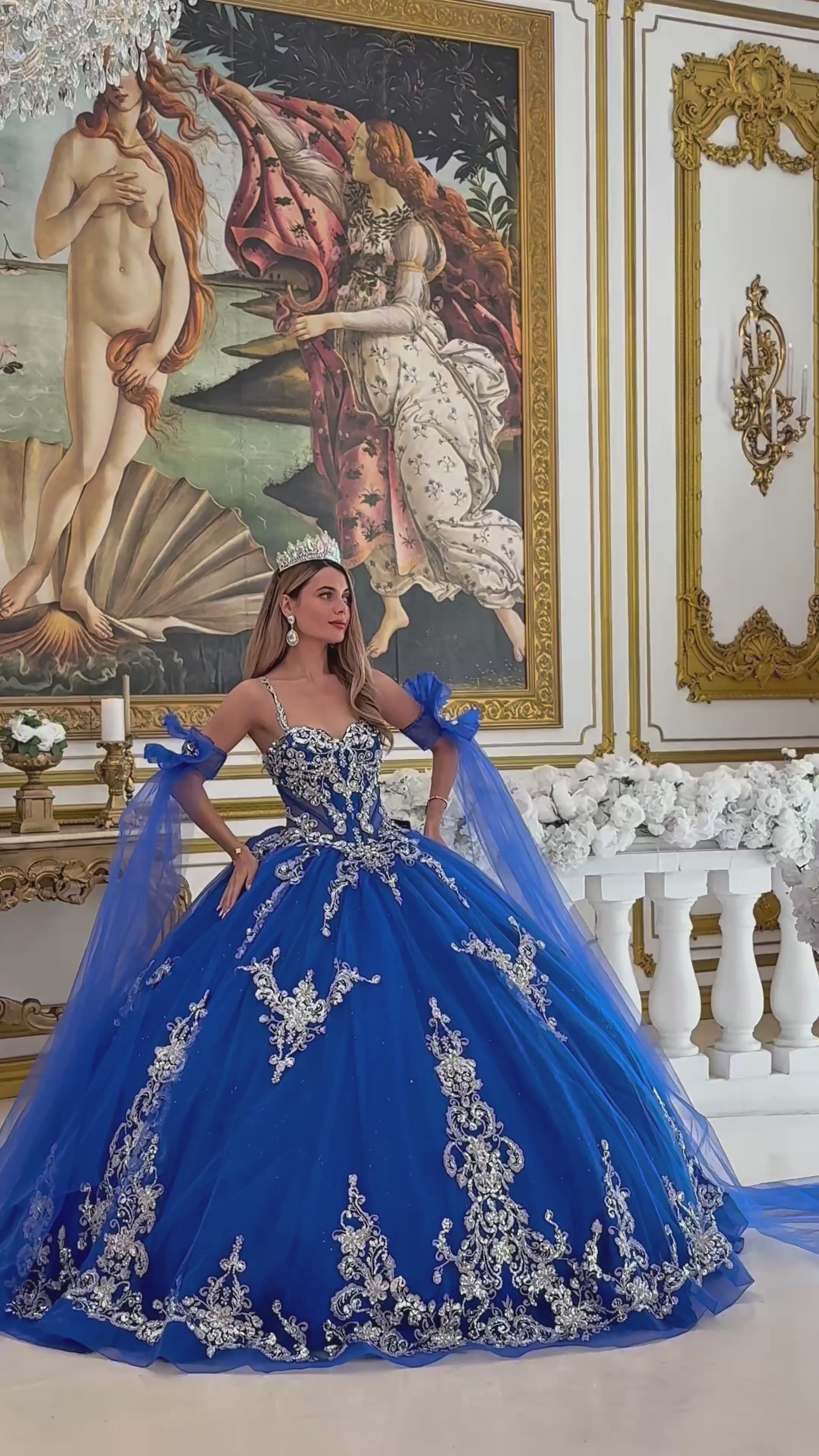 girl in a Blue ball gown with intricate silver embroidery in a decorated room. video
