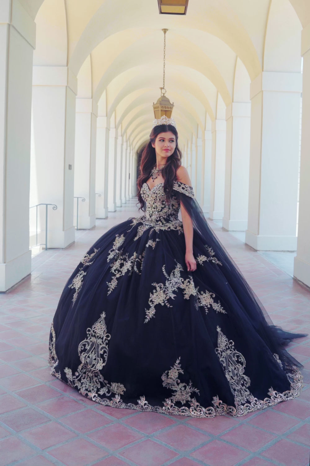 Quinceanera | Black with Gold Embroidered Lace with Stunning Cape Quince Ballgown dress - video of woman wearing dress