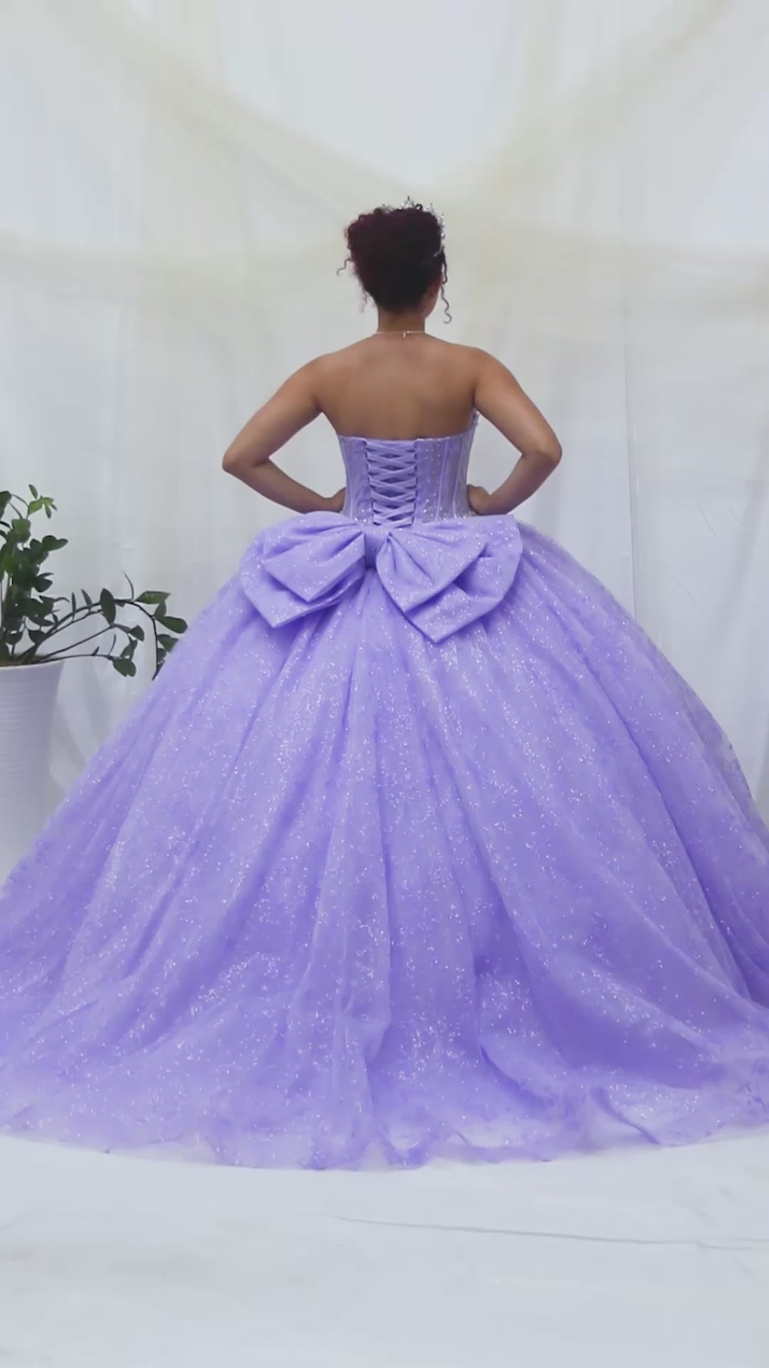 Video of Lilac Quinceañera Dress with Crystal Beading, Glitter Floral Tulle and Front Bow Detail