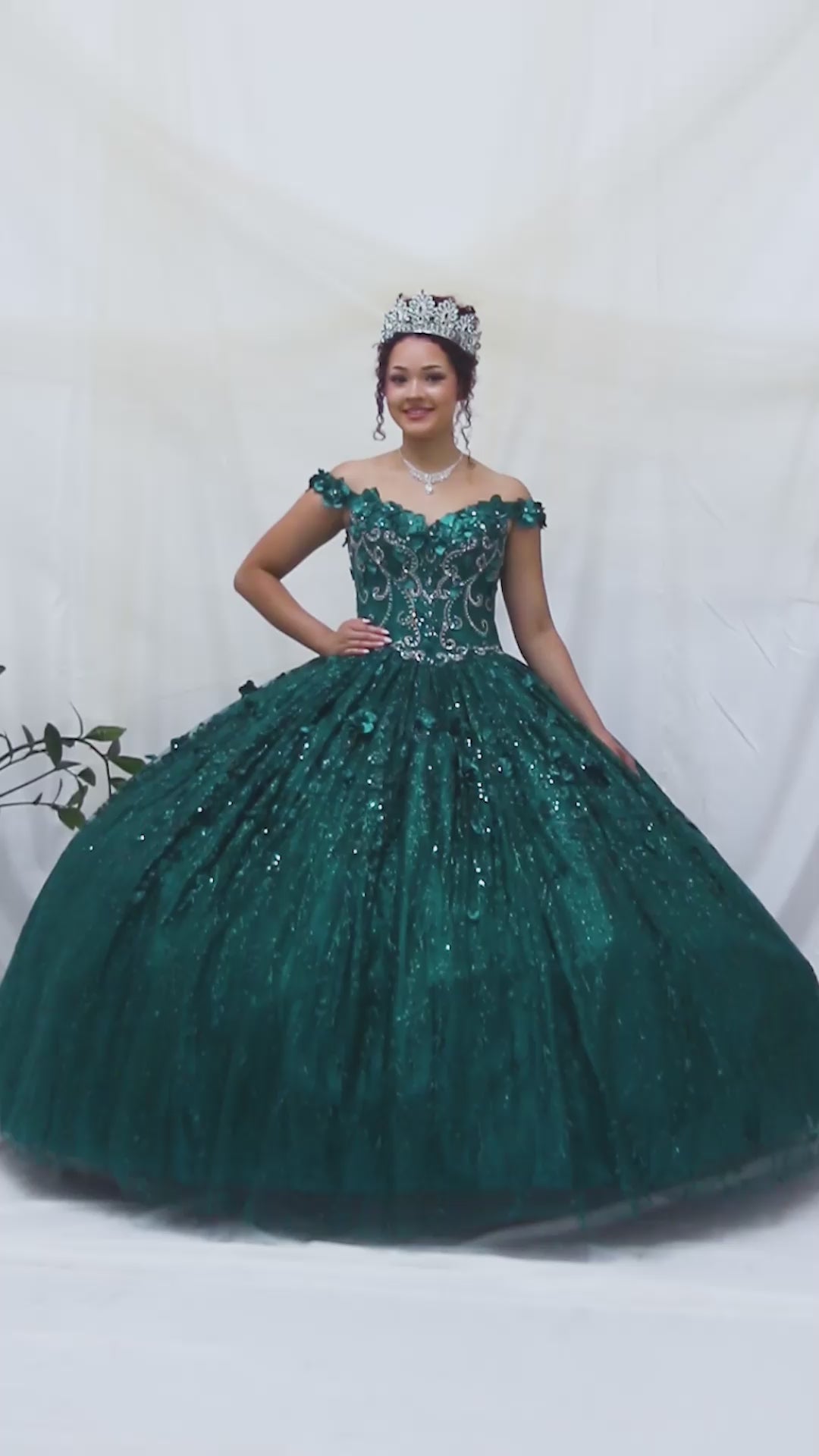 Video of Emerald Green Quinceañera Dress with Delicate Floral Appliques and Romantic Flowing Skirt