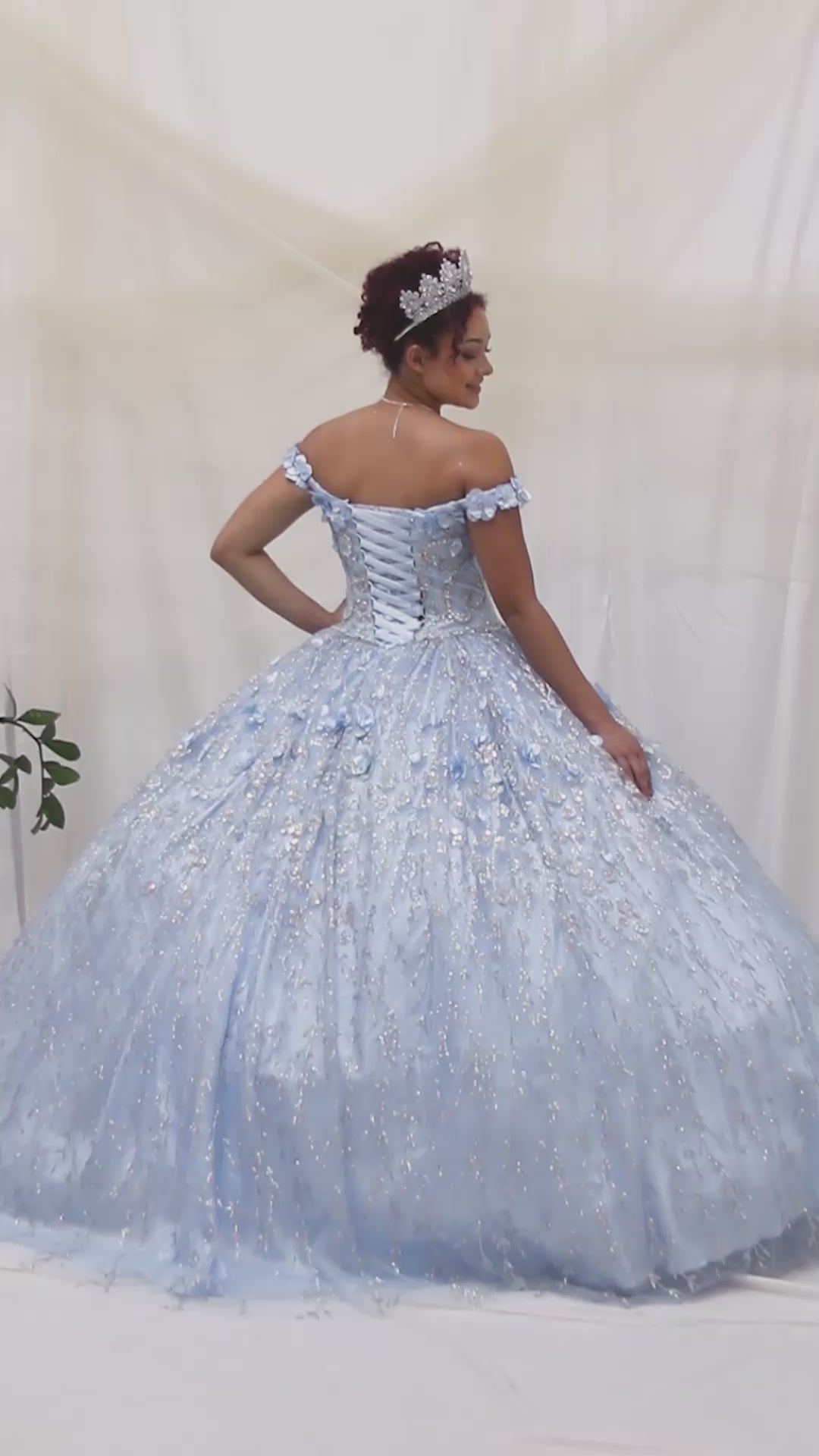 Video of Bahama Blue Quinceañera Dress with Delicate Floral Appliques and Romantic Flowing Skirt