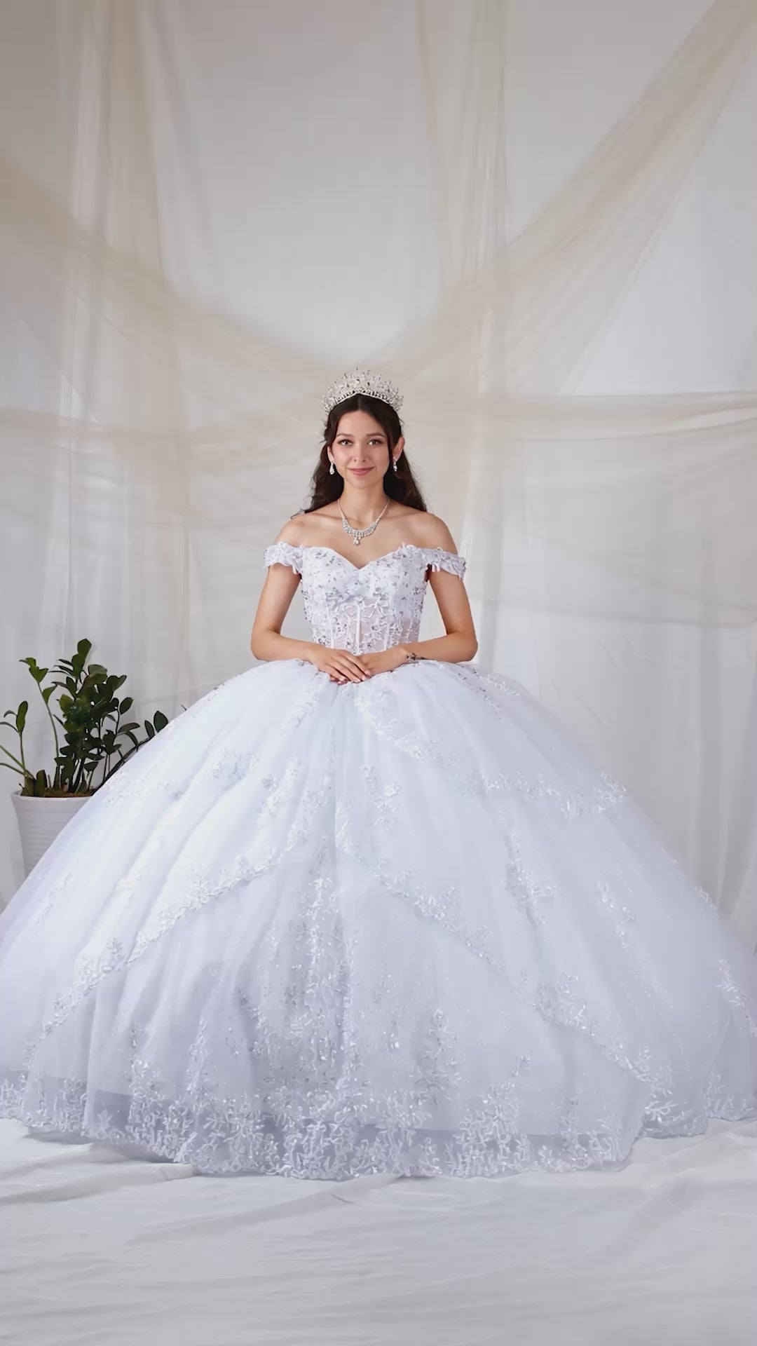 Video of White Quinceañera Dress with Sheer Sweetheart Bodice, Floral Embroidery and Glitter Tulle