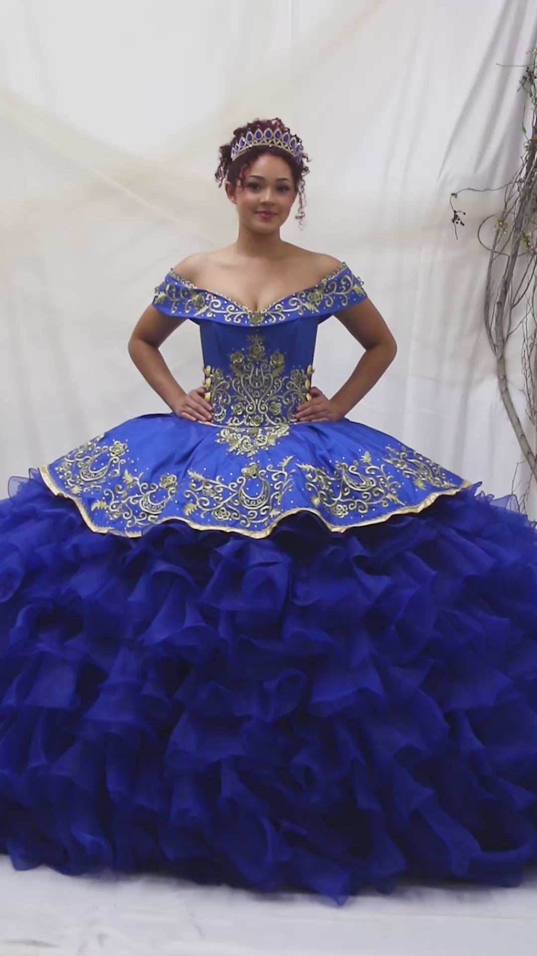 Video of Royal Blue Quinceañera Dress with Gold Embroidery, Ruffle Charra Design and Beaded Bodice