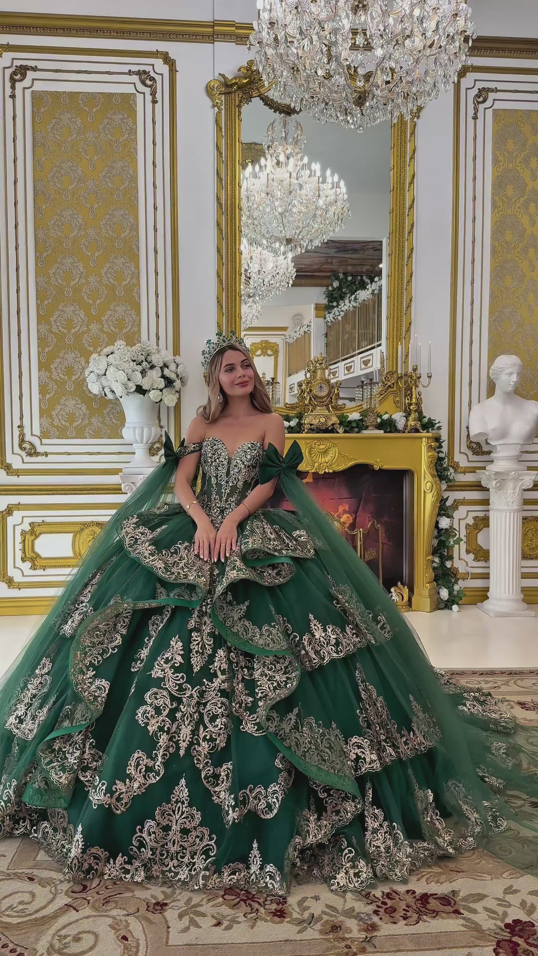 video of Woman in a green gown with gold embroidery in an ornate room.