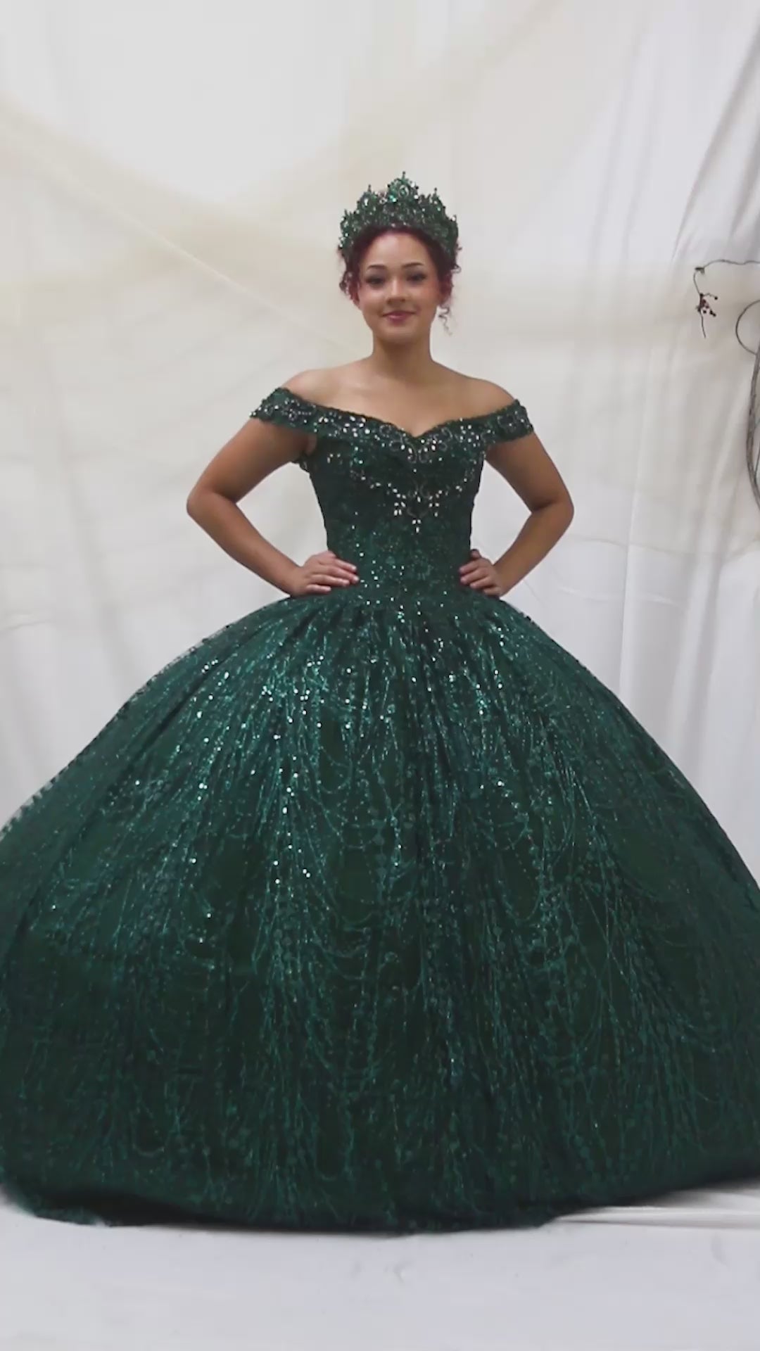 Video of Emerald Green Quinceañera Dress with Glitter Sequins, Layered Skirt and Detachable Flowing Cape