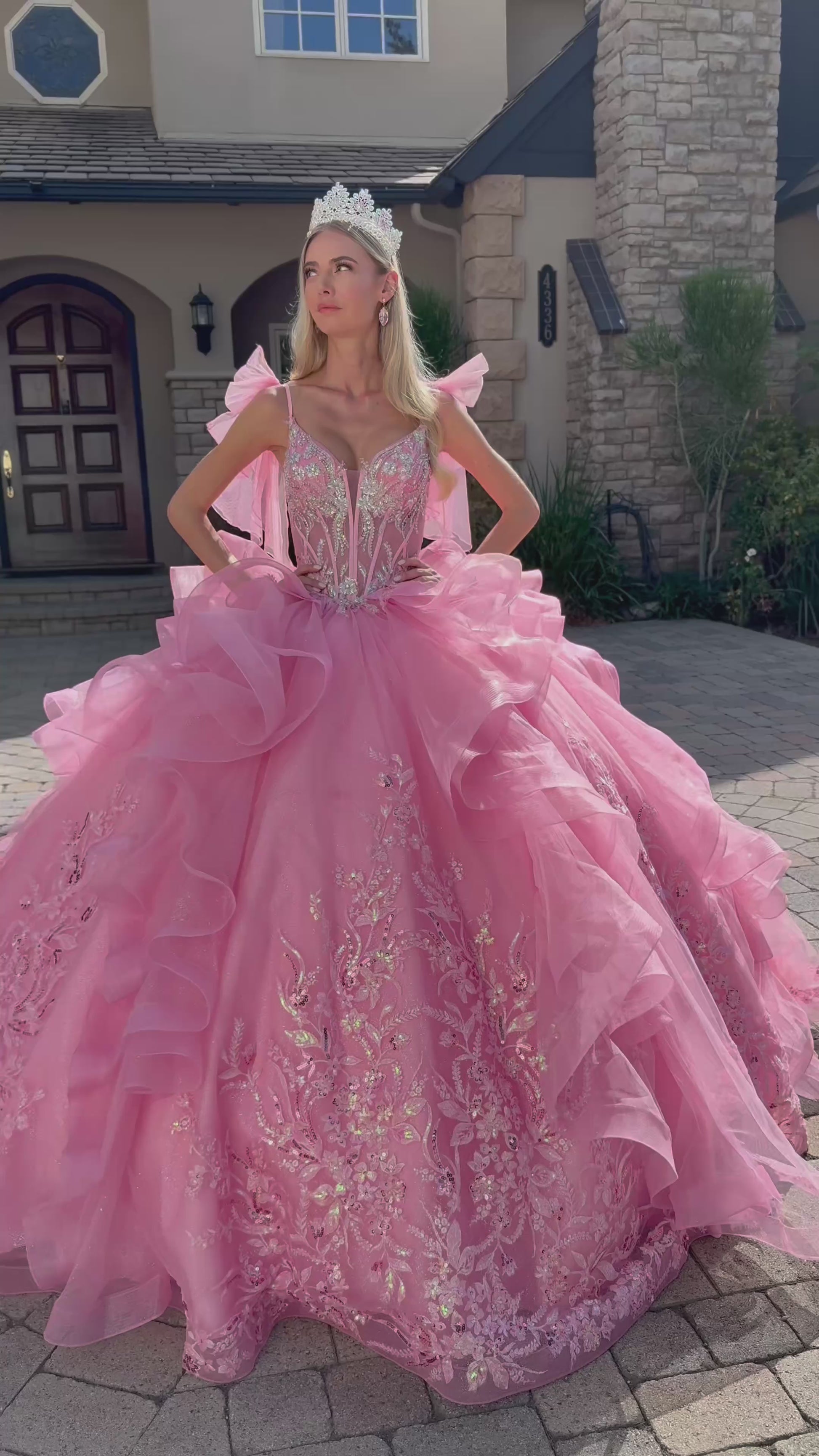video of a girl wearing pink quinceanera dress outdoor near a house