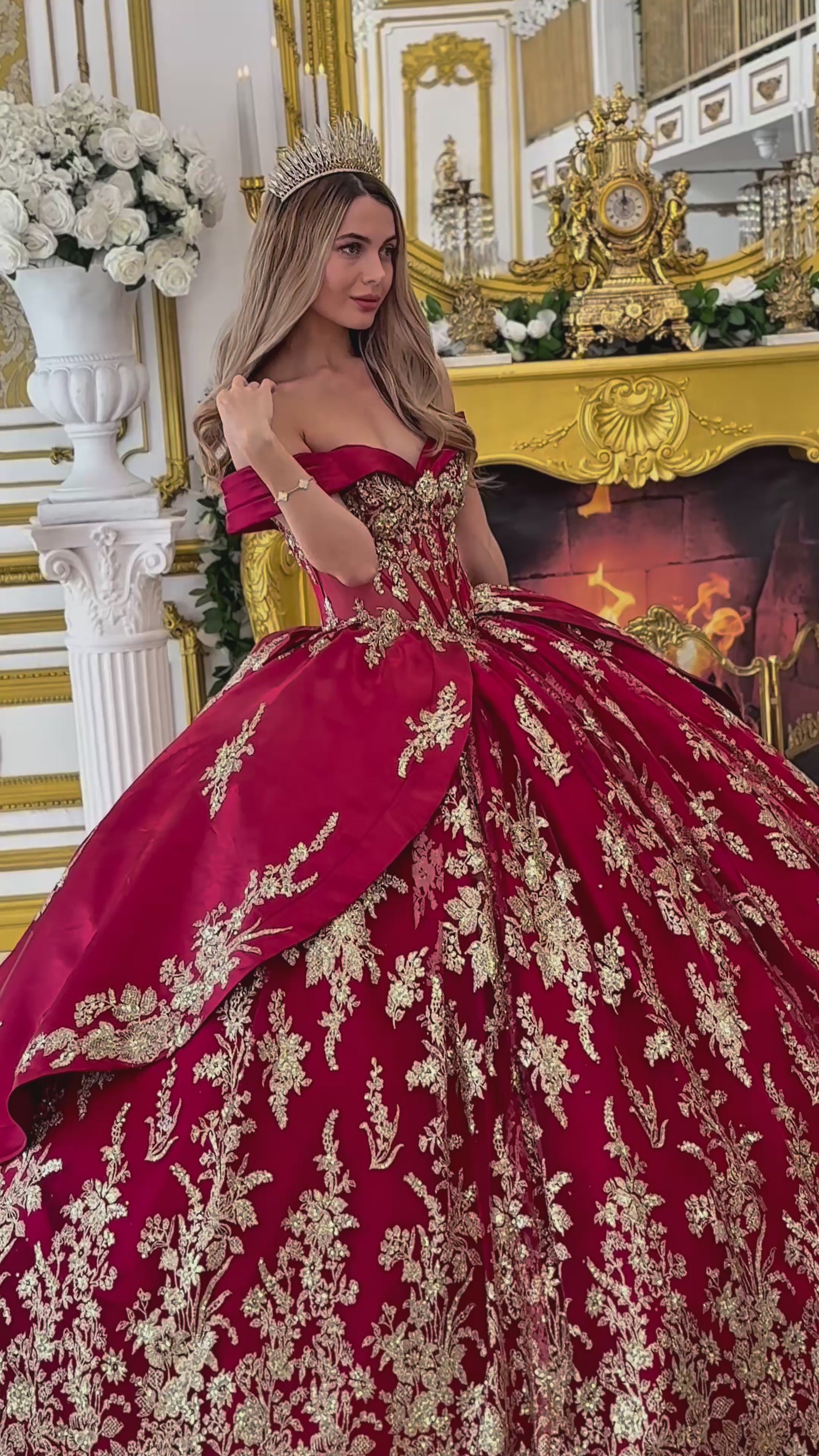 Video: a girl wearing a burgundy quinceanera dress with gold floral embroidery 